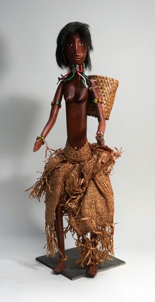 Female puppet from the village carrying a...