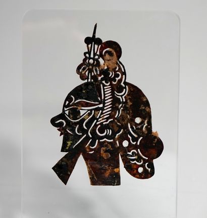 Old shadow puppet head, cut out animal skin,...