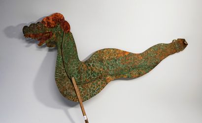 Old puppet presenting the green Naga from...