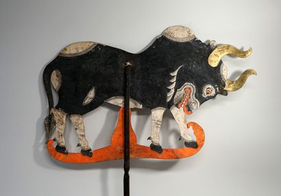Old puppet presenting a buffalo from the...