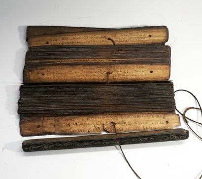 Old folding Lontar (book) whose pages are...
