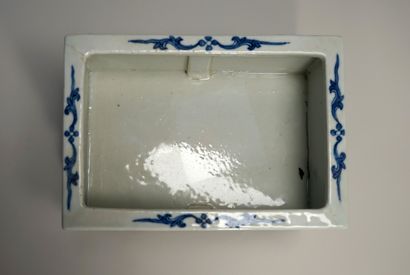 White and blue porcelain planter decorated...