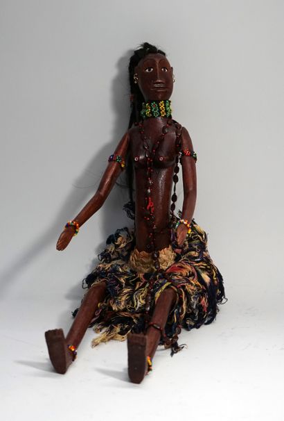 Female puppet. She wears a loincloth and...