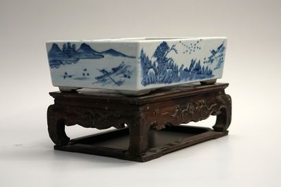 White and blue porcelain planter decorated...