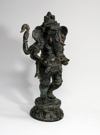 Standing Ganesh with four arms, on a lotiform...