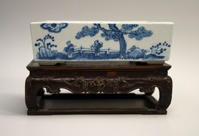 White and blue porcelain planter decorated...