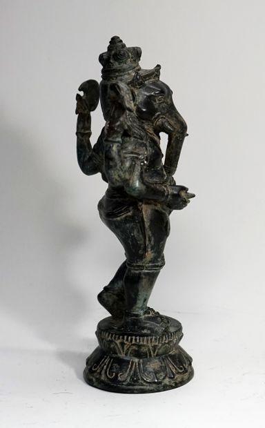 Standing Ganesh with four arms, on a lotiform...