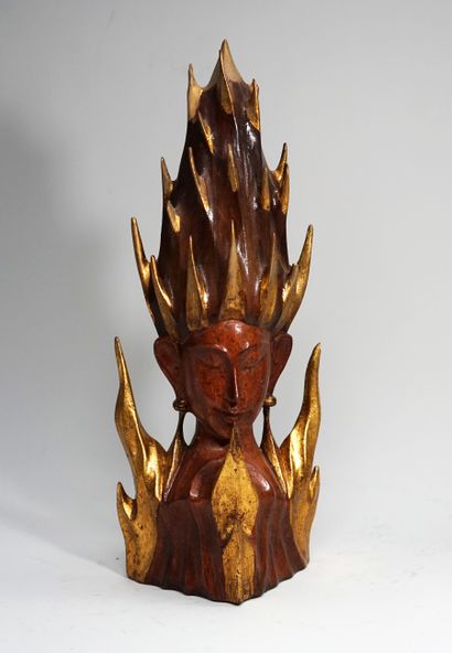 Decorative head of deity in natural wood...