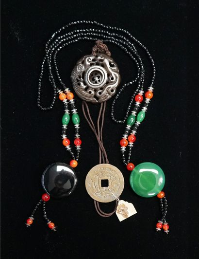 SET composed of 3 necklaces: one holding...