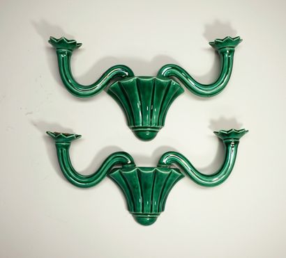 Pair of green ceramic sconces, one with a...