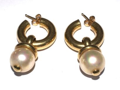 PAIRE DE CREOLES en or jaune 18K (750/°°)...