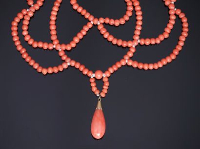 NECKLACE draped with balls of antique orange...