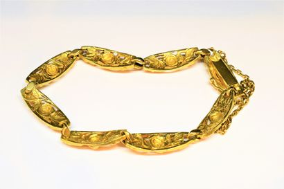 BRACELET in 18K (750/°°) yellow gold filigree...