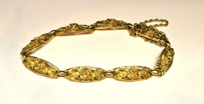 BRACELET in 18K (750/°°) yellow gold filigree...