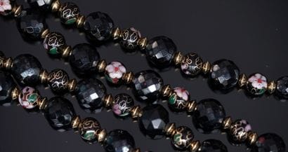 SAUTOIR in black faceted glass balls interspersed...