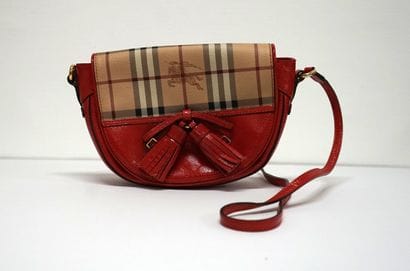 BURBERRY - Red messenger bag. Signed. Good...