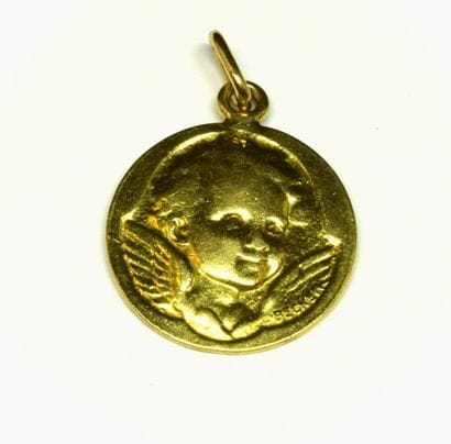 PENDENTIF en or jaune 18K (750/°°) figurant...