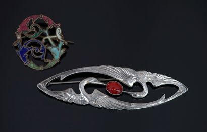 Antique silver-plated metal pin featuring...