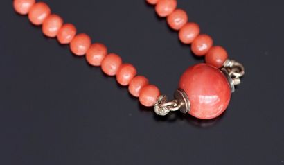 NECKLACE draped with balls of antique orange...