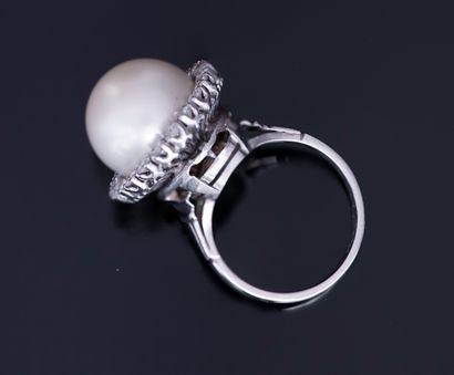 Platinum ring centered on a large white cultured...
