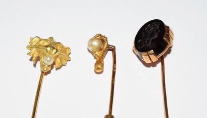 SET of three 18K (750°) gold pins, one with...