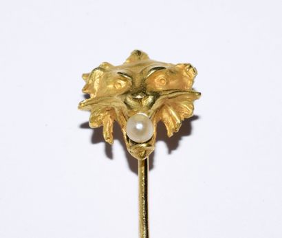SET of three 18K (750°) gold pins, one with...
