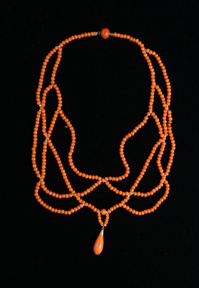 NECKLACE draped with balls of antique orange...