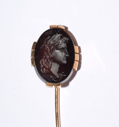 SET of three 18K (750°) gold pins, one with...