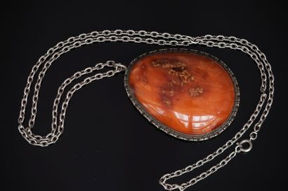 Silver CHAIN and PENDANT holding a drop-shaped...