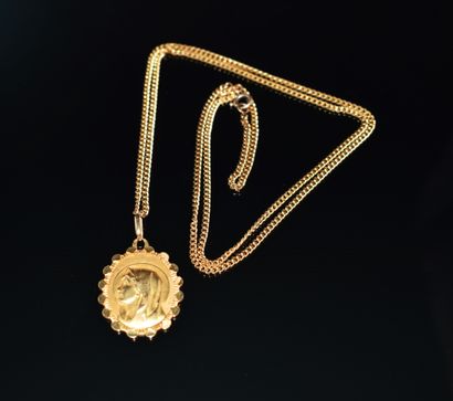 MEDAILLE en or jaune 18K (750/°°) ornée de...