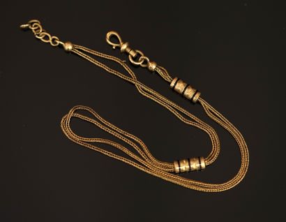CHAINE GILETIERE en or jaune 18K (750/°°)...