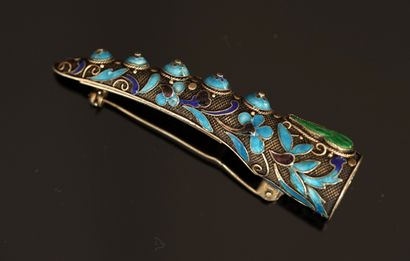 Claw-shaped silver brooch with blue enameled...
