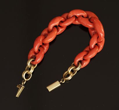 BRACELET with carved coral coffee bean links,...