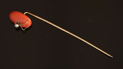 EPINGLE en or 14k (585/°°) retenant une perle...