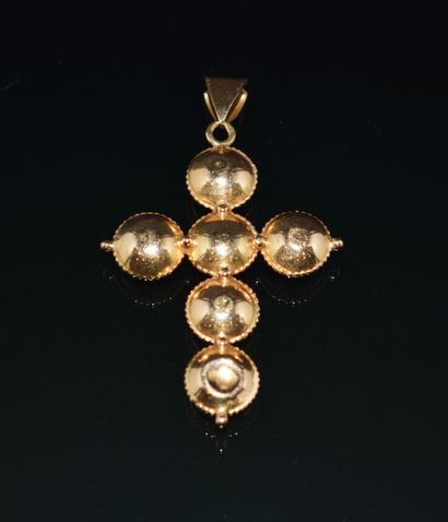 CROSS PENDANT in 18K (750/°°) yellow gold...