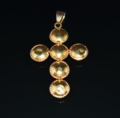 CROSS PENDANT in 18K (750/°°) yellow gold...