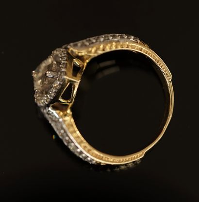 Yellow gold and white gold ring centered...