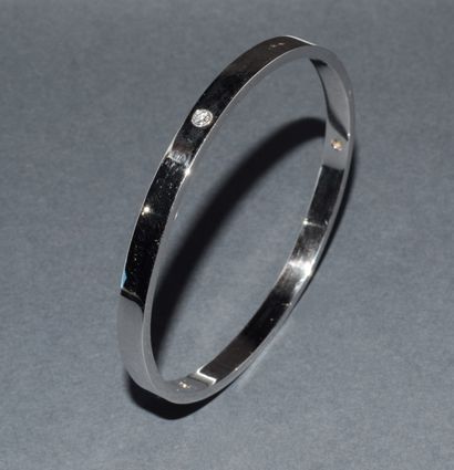 JONC in 18K (750/°°) white gold, punctuated...