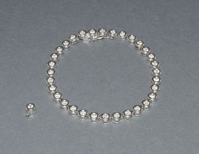 BRACELET rivière in 18K (750/°°) white gold...