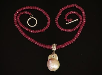 COLLAR made of round ruby beads in drop,...
