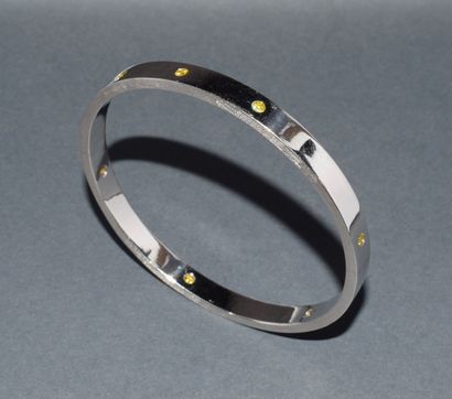 JONC in 18K (750/°°) white gold, punctuated...