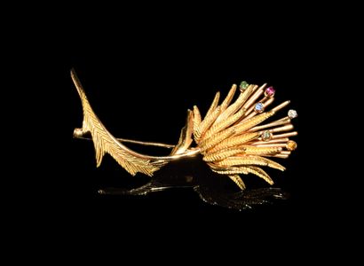 BROCHE en or jaune 18K (750°/°°), stylisant...
