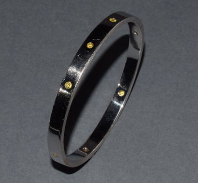 JONC in 18K (750/°°) white gold, punctuated...