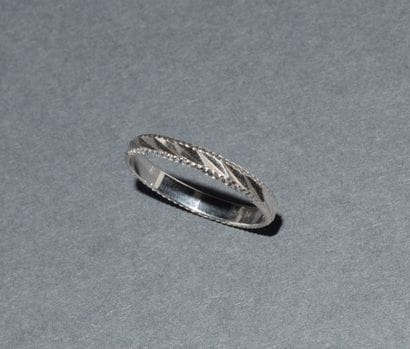 ALLIANCE in chased 18K (750/°°) white gold....
