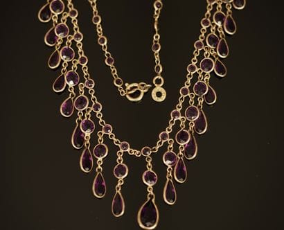 DRAPERIE NECKLACE in gilded metal adorned...