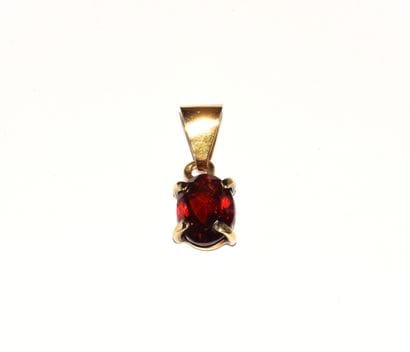 PENDANT in 18K (750°/°°) yellow gold, set...