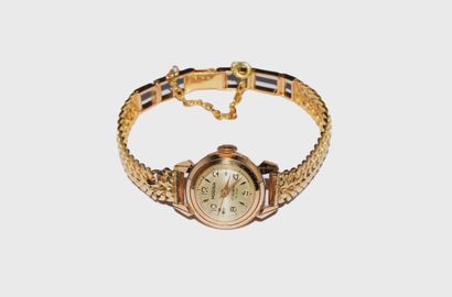 HODNA - MONTRE BRACELET signée, en or jaune...