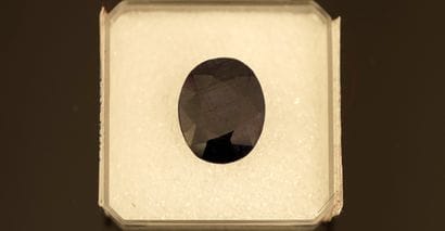 Dark blue opaque treated SAPHIR, oval on...