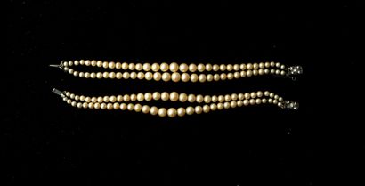 PAIR of imitation pearl bracelets, the silver-plated...