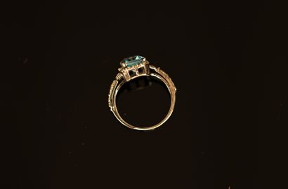 Black patinated silver ring centered on a...